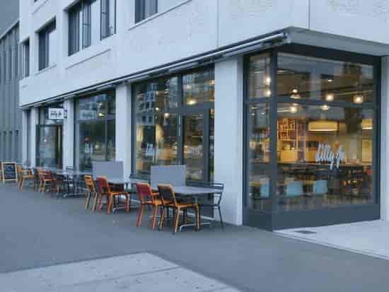 Modern Lilly Jo café with large windows, perfect for casual meetings and events.