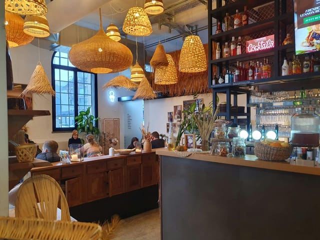 Cozy café in Lennox Restaurant with wicker decor, perfect for networking events.