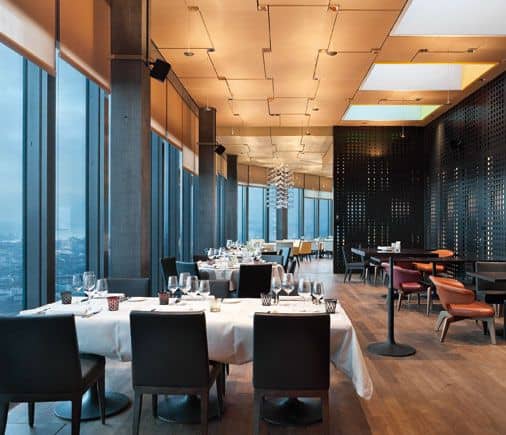Smokers Lounge at CLOUDS Kitchen: elegant dining space with stunning views for private events.