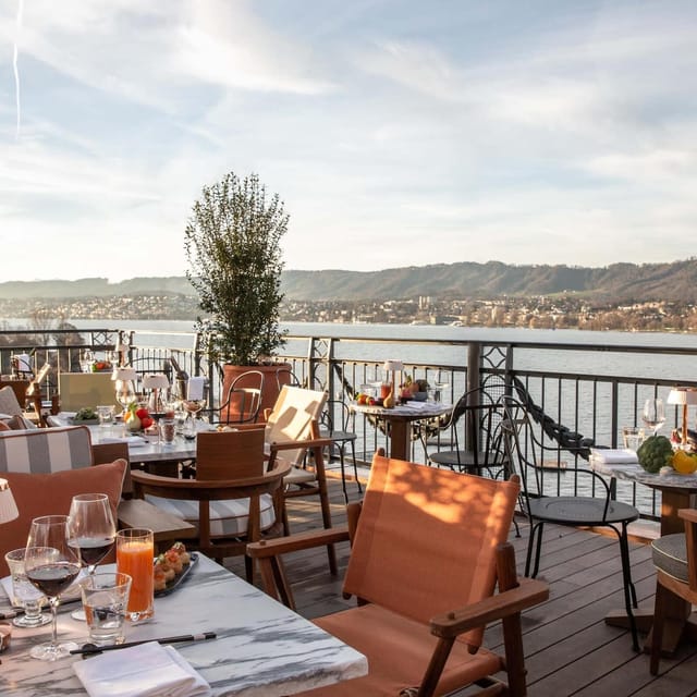 Elegant rooftop dining at Baur au Lac with stunning waterfront views for upscale events.