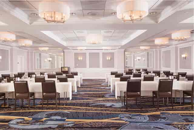 Elegant Schuyler in Hamilton Hotel event space with chandeliers for conferences and banquets.