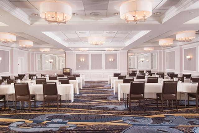Elegant Schuyler in Hamilton Hotel event space with chandeliers for conferences and banquets.