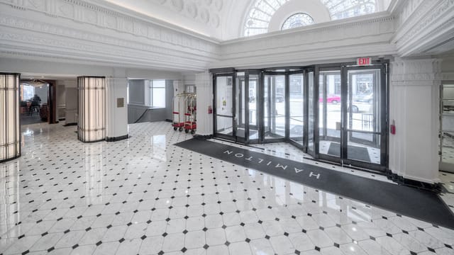 Spacious Hamilton Hotel prefunction lobby, ideal for conferences and upscale events.