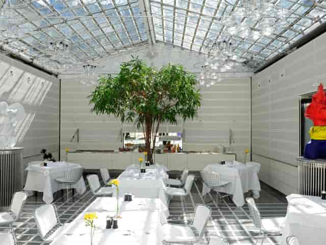 Bright modern event space at Widder Hotel with glass ceiling, perfect for meetings and gatherings.