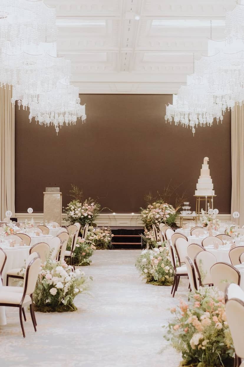 Jubilee Ballroom at Raffles Singapore, elegant wedding venue with grand chandeliers.