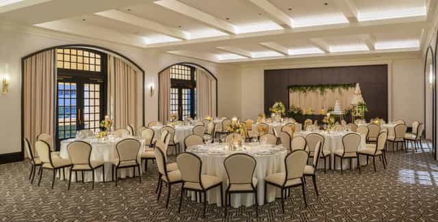 East India Room at Raffles Singapore, elegant wedding venue with floral decor.