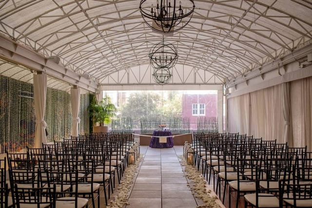 Elegant meeting room with natural light, perfect for weddings and corporate events.