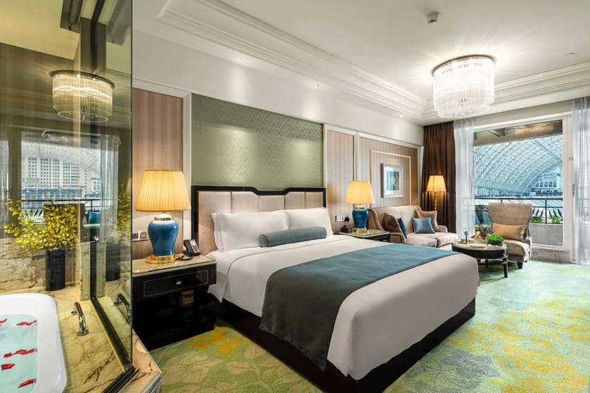 Luxurious hotel room with king-size bed, perfect for corporate events in Chengdu.