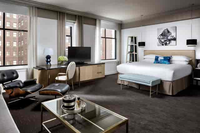Stylish hotel room with a comfortable bed for event attendees at The Blackstone.