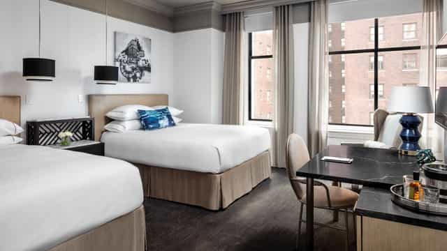 Boardroom in The Blackstone, featuring two beds, ideal for events and meetings.