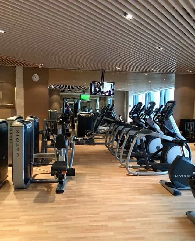 Modern gym in Chengdu Hotel, featuring workout machines for wellness-focused events.