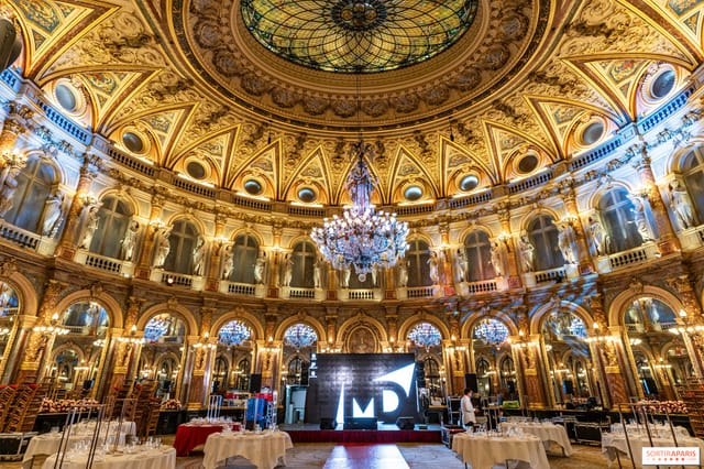 Opulent Salon Delibes venue with ornate ceiling, perfect for gala events and meetings.