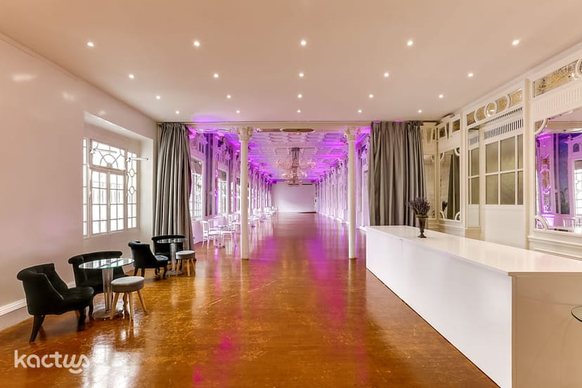 Elegant function room with purple lighting, perfect for events and gatherings.