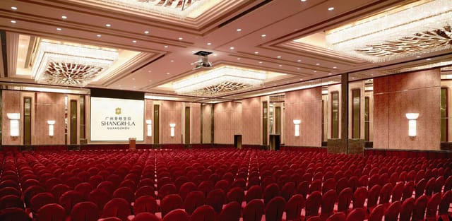 Auditorium in Shangri-La Guangzhou with red carpet, ideal for corporate events and conferences.
