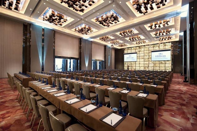 Conference Hall in Hilton Guangzhou: elegant seating for corporate events and presentations.