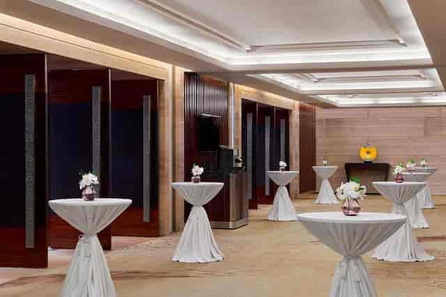 Grand Ballroom at The Westin Guangzhou, elegant space with floral centerpieces for receptions.
