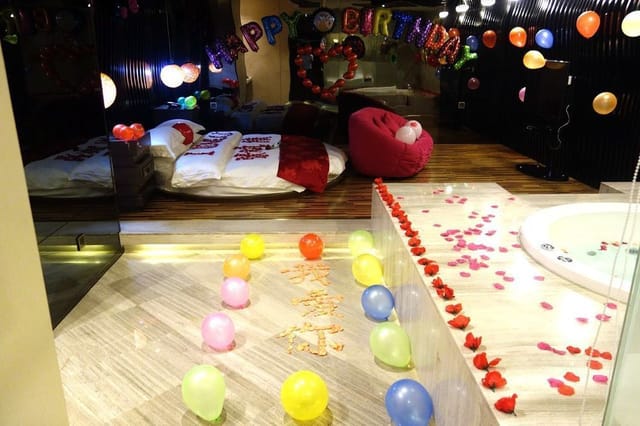 Colorful balloon decorations in Secret Garden for a festive birthday celebration.