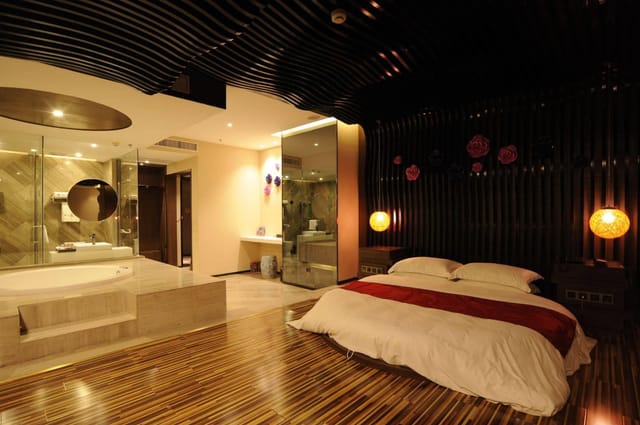 Modern hotel room with open bathroom design in Secret Garden, perfect for luxury retreats.