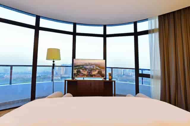 Modern conference room with panoramic windows at Grand Skylight Hotel for meetings.