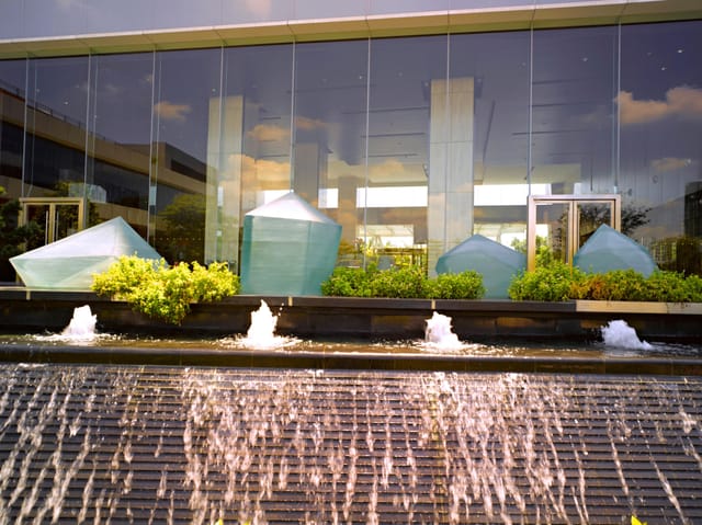 Outdoor event space at Crowne Plaza Guangzhou Huadu with water features and greenery.
