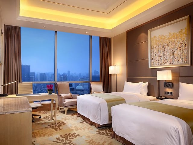 Modern hotel suite with city view, ideal for conferences and events.
