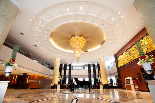 Golden Hall at Dong Fang Hotel: elegant lobby with chandelier for events and gatherings.