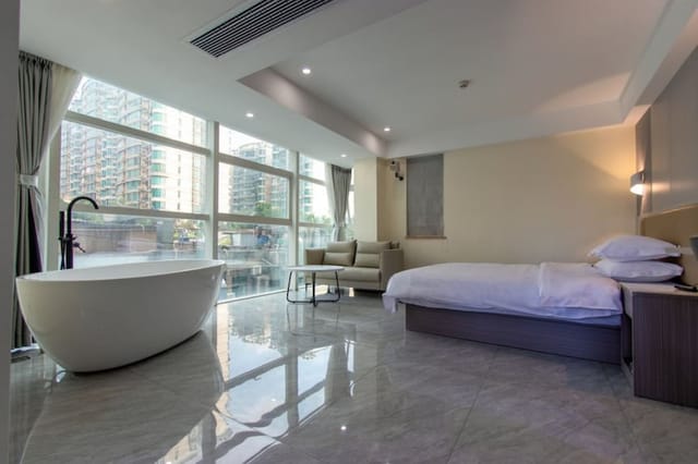 Sleek hotel room in Deyu Business Hotel, ideal for corporate meetings and retreats.