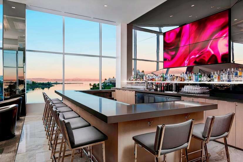 Sleek bar at AC Hotel San Francisco with waterfront view, perfect for events and receptions.