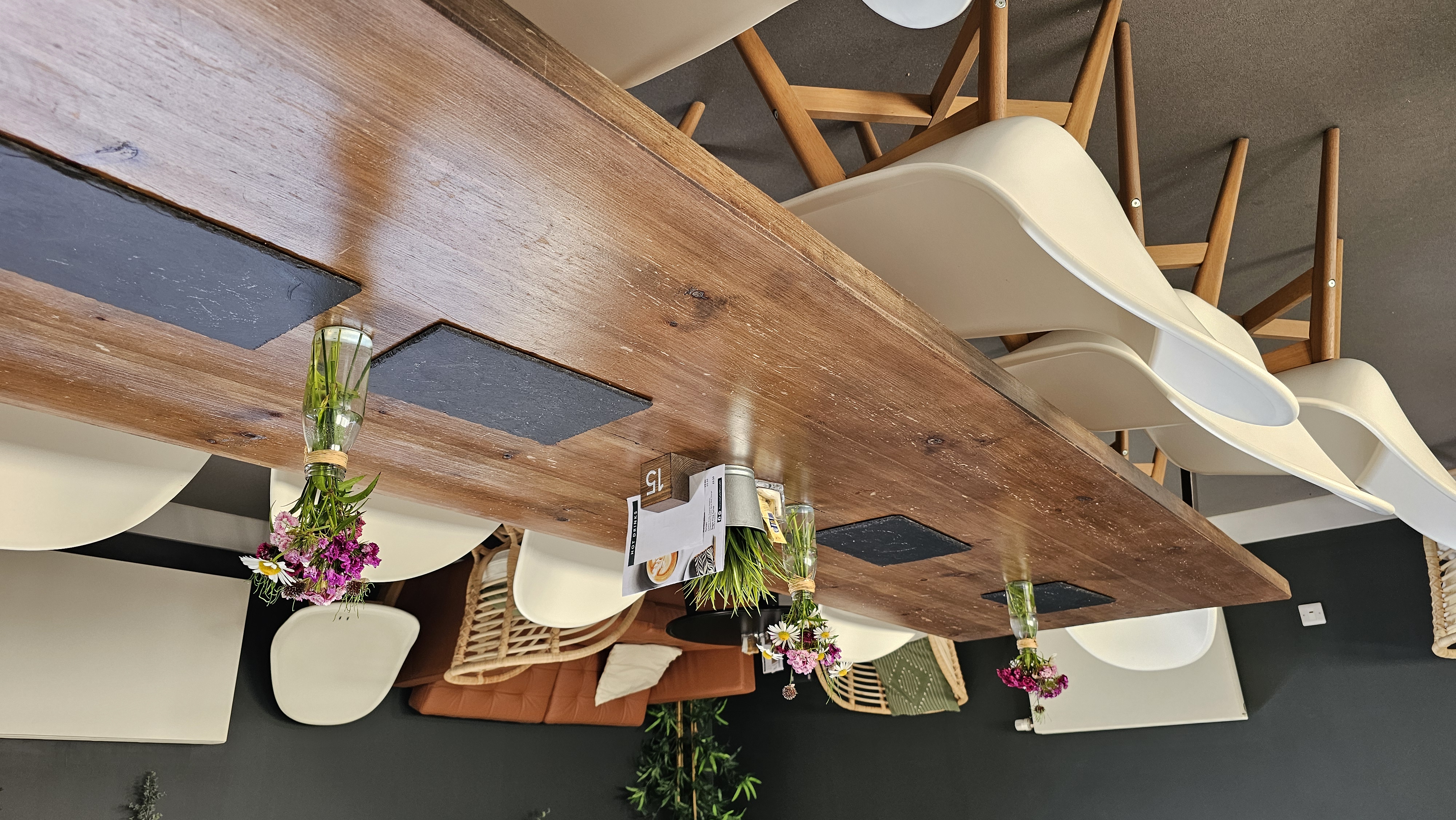 Stylish Riverside Conferencing Lower Lounge for meetings, featuring a wooden table and modern chairs. - Banner