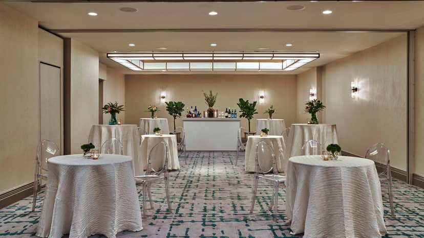 Elegant event space in Viceroy DC with round tables, ideal for corporate gatherings.