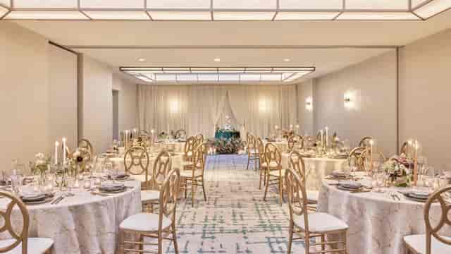Elegant wedding reception setup with lace tablecloths and floral centerpieces in DC.