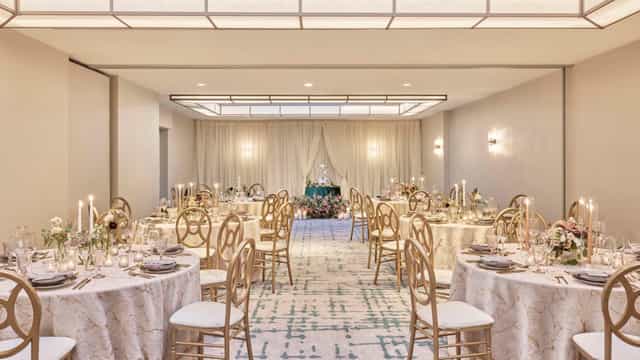 Elegant wedding reception setup with lace tablecloths and floral centerpieces in DC.