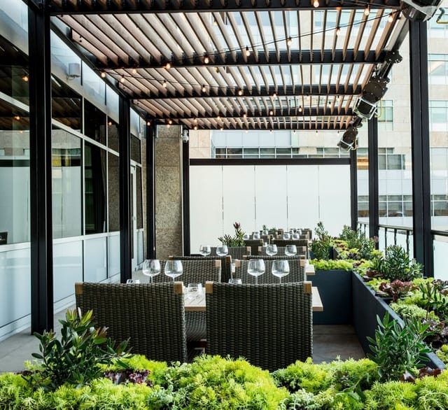 Heated terrace dining area at STEM Kitchen + Garden, perfect for events and meetings.
