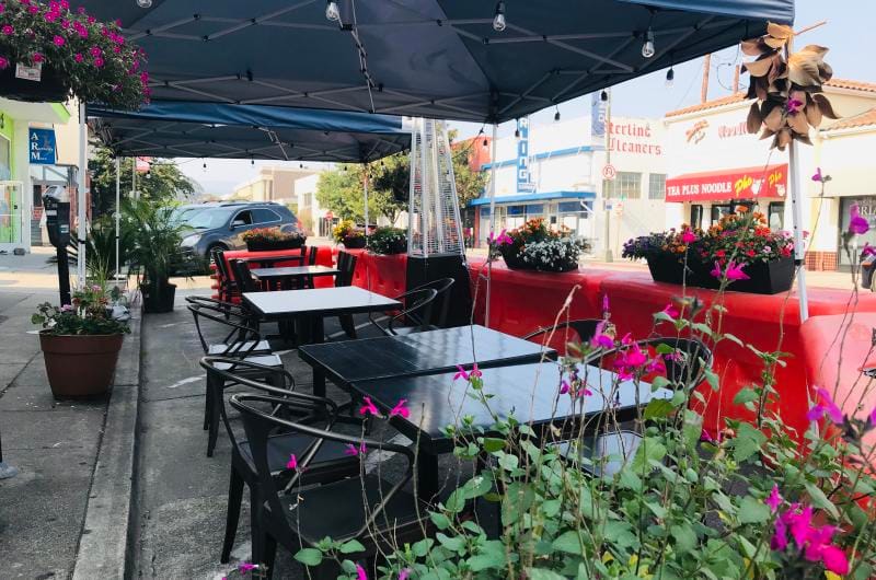 JC Bruno Restaurant patio with floral decor for outdoor dining and corporate event venue.