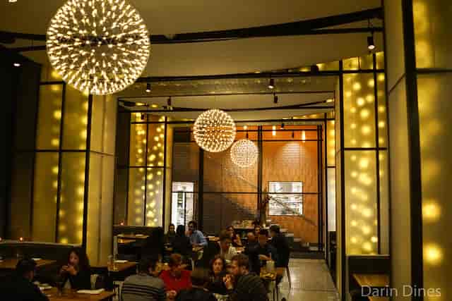 Modern restaurant in Mourad with stylish lighting, ideal for networking events and private dinners.