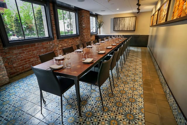 Elegantly set long table in Mourad restaurant for intimate gatherings and events.