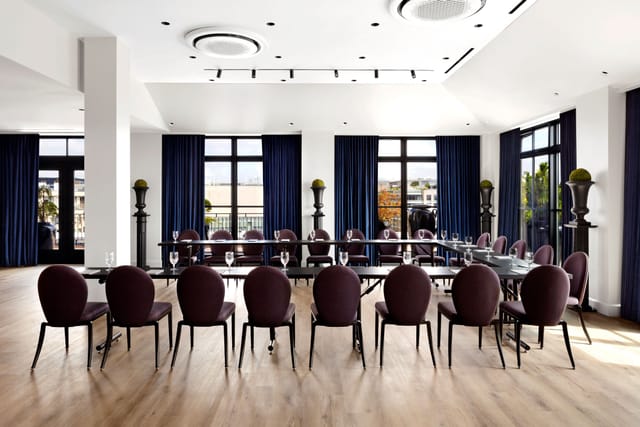 Elegant meeting room at Rooftop at Riggs, ideal for corporate retreats and workshops.