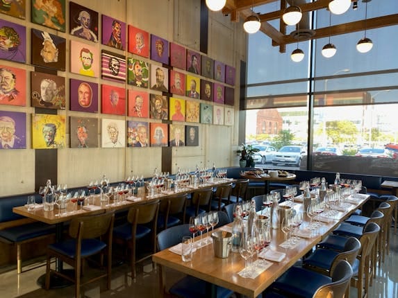 Stylish District Winery event space with elegant dining table, ideal for networking dinners.