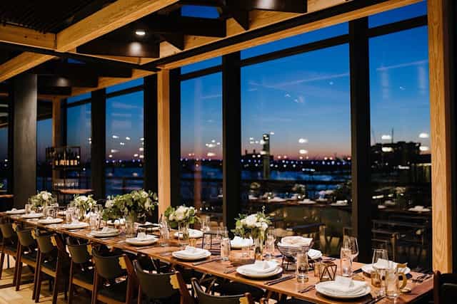 Elegant dining area in District Winery's Portrait Room, perfect for upscale events.