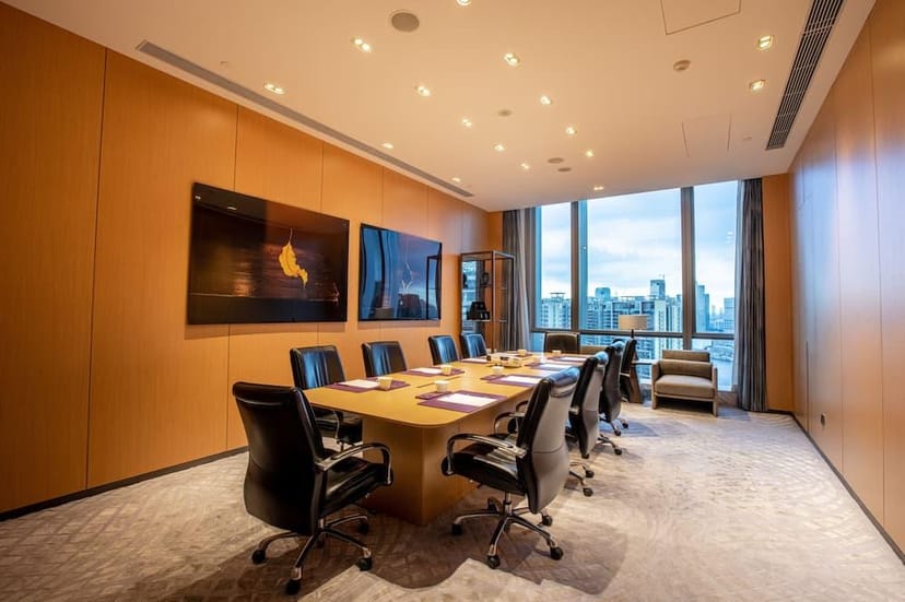 Modern conference room in Conrad Guangzhou with panoramic city views for business meetings.