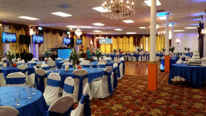 Elegant restaurant event space with blue tables, ideal for weddings and corporate functions.