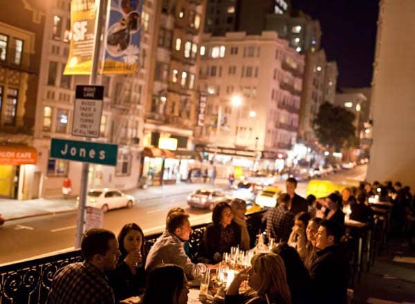 Vibrant rooftop restaurant at night, ideal for networking and social gatherings.