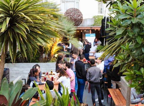 Lush outdoor event space at Rooftop Restaurant, ideal for networking and social gatherings.