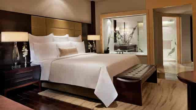 Luxurious JW Marriott Mumbai room with king-sized bed for VIP events and meetings.