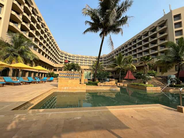 Yamuna courtyard at JW Marriott Mumbai Juhu with serene pool, ideal for events.