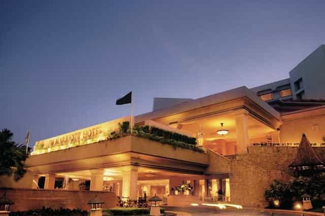 Elegant hotel entrance at JW Marriott Mumbai Juhu for versatile event hosting.