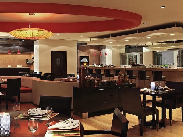 Burgundy restaurant, elegant decor, ideal for meetings and events at Novotel Mumbai.