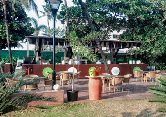 Outdoor catering setup at Novotel Mumbai Juhu Beach for relaxed networking events.