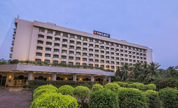 LaLiT Mumbai hotel exterior with lush greenery, ideal for conferences and events.