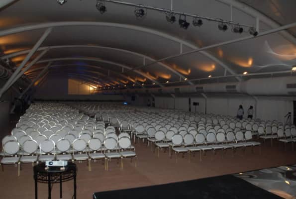 Spacious Lalit Lawn venue with white seating for conferences and presentations in Mumbai.
